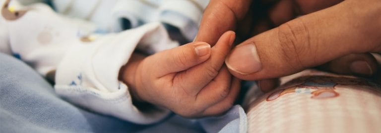 Newborn in safe obstetrician hands